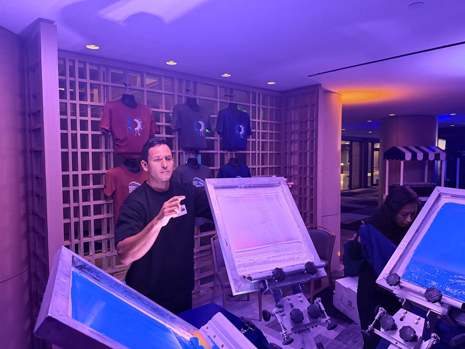 Live printing presses glowing at an evening event
