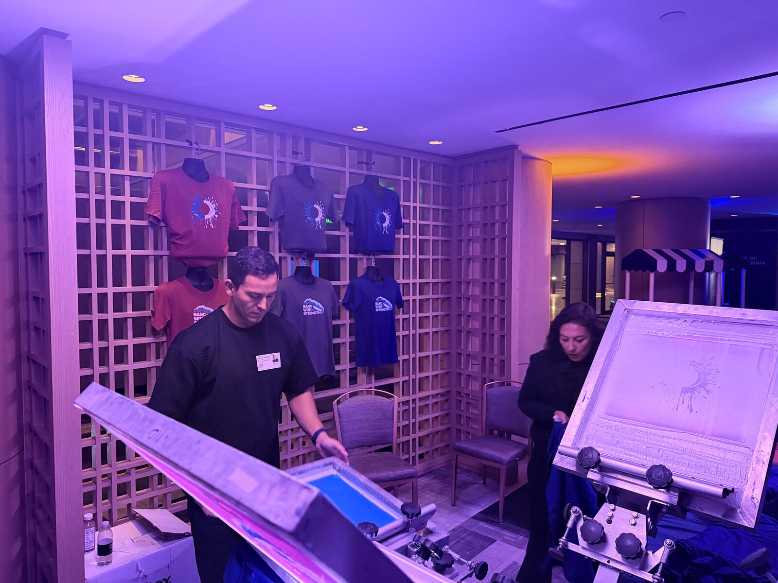 Wall of event shirts printed at a rented station