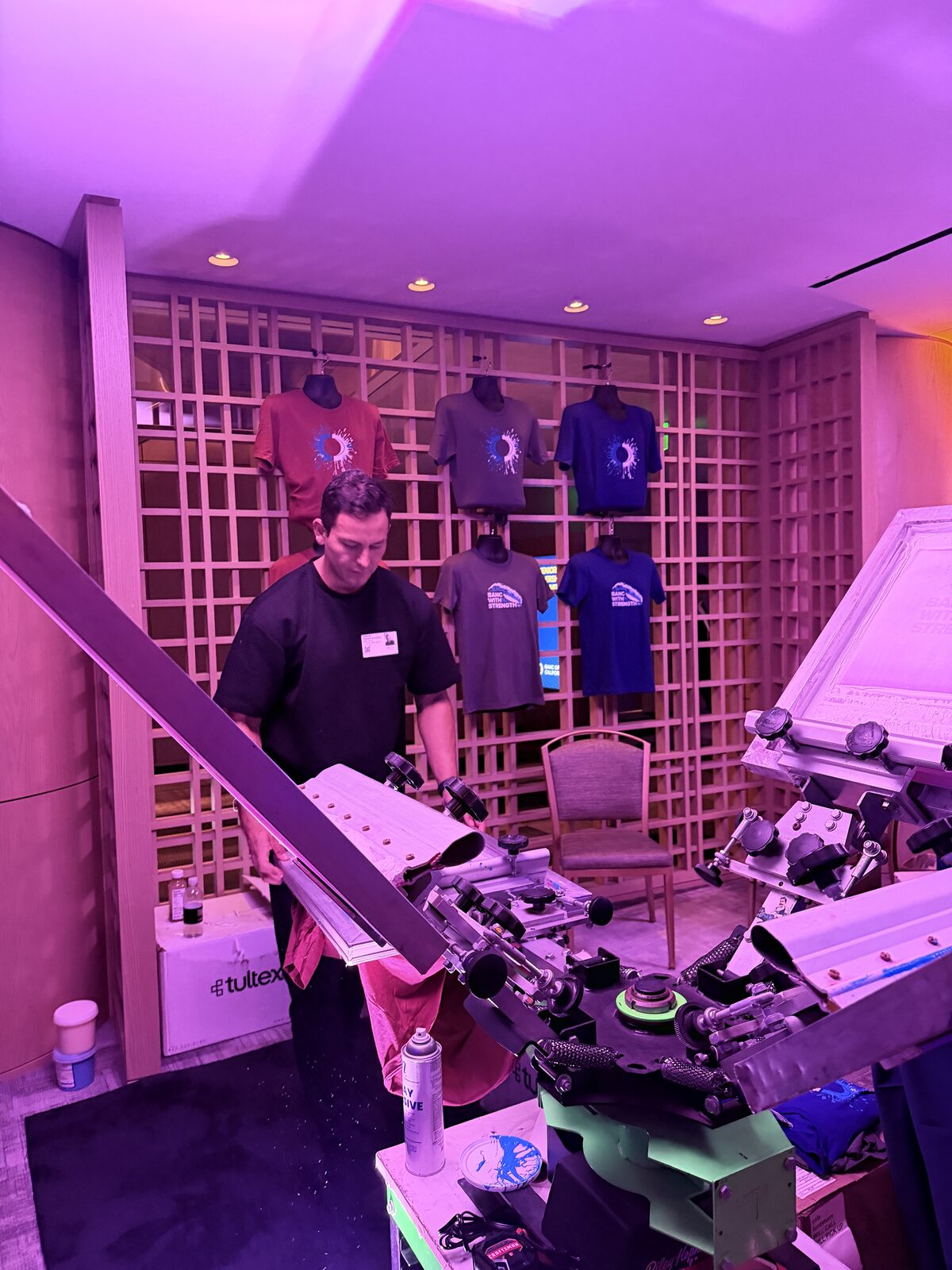 Operator loading a shirt onto a rented press